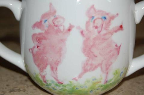 TIFFANY DANCING PIGS TWO HANDLED MUG IN AS NEW CONDITION BOXED