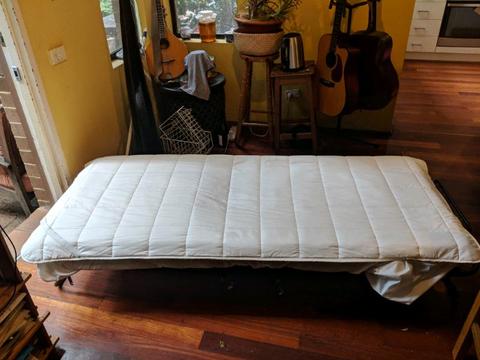 Kids fold up bed - on wheels with mattress protector