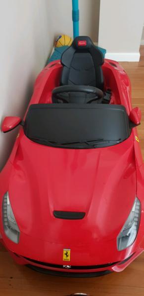 Kids ride on Ferrari