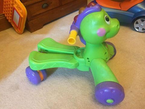 Kids ride on toy (dinosaur) with lights and song
