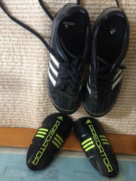 Addidas football boots and shin pads for school child