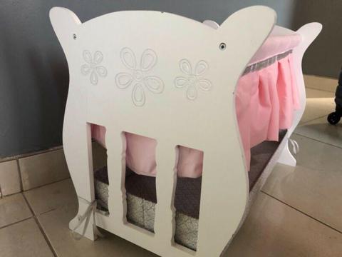 Toy cradle with baby