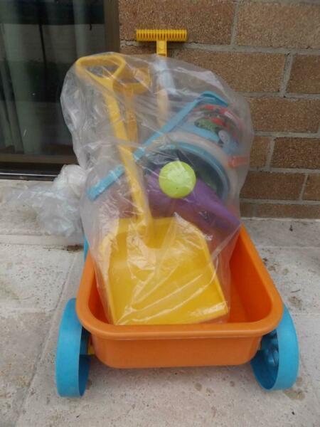 Kids pull toy and beach/sandpit buckets, scoops etc