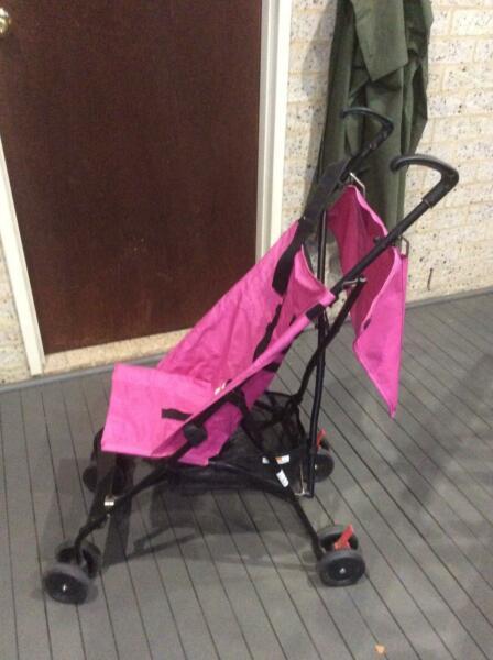 Childs pink stroller