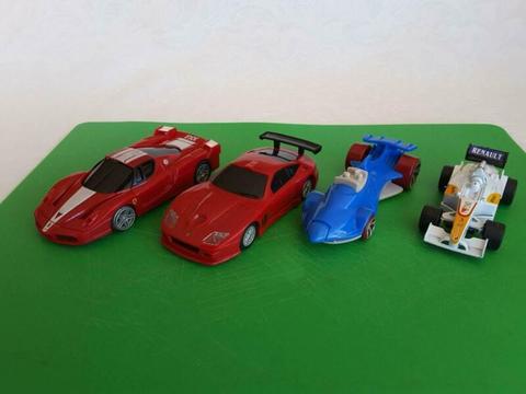 FOUR TOY CARS