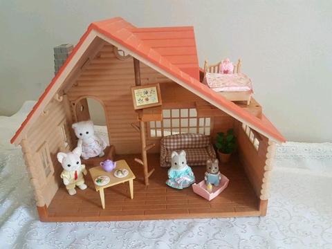 Sylvanian families log cabin with animals and stuff