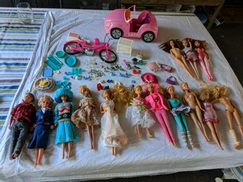 Assorted Barbie dolls and accessories
