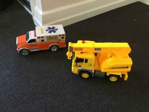 Toy ambulance and crane