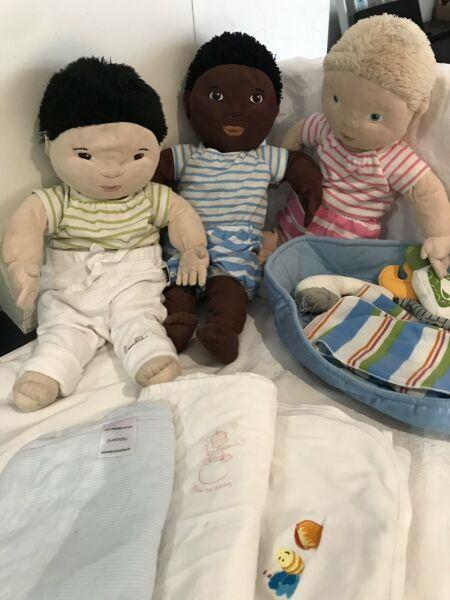 Soft multicultural dolls with clothes and toys
