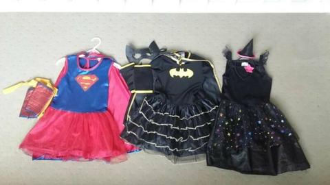 3 x young girls dress up costumes. Supergirl, batgirl, witch