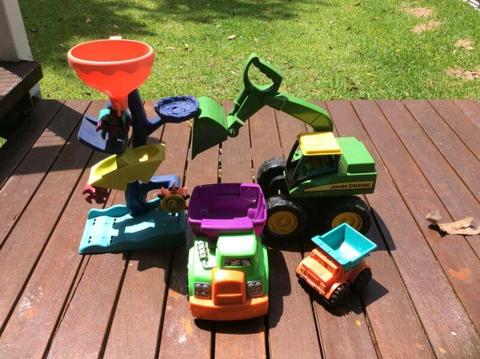 Lot of 4 sandpit or beach toys - trucks, digger and funnel wheel