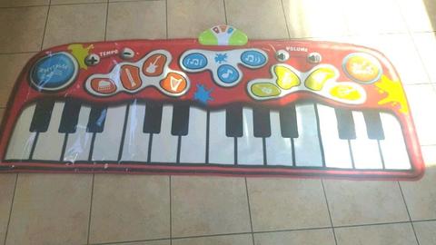 Brand new piano mat