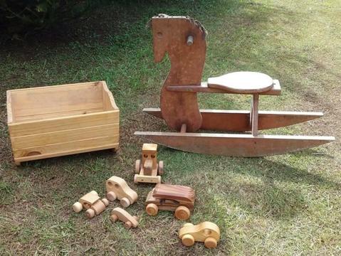 Wooden toy cars, rocking horse and rocking cradle