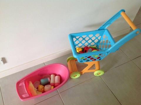 Toy baby bath and shopping trolley