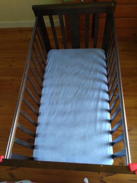 Wooden baby cot with mattress