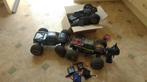 RC trucks 2x with box of spares