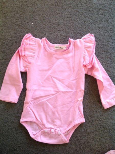 Light pink long sleeve flutter body suit size 12-18 months