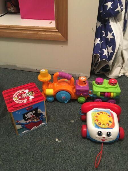 Toy train, telephone, jack in the box