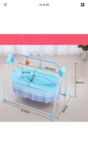 Baby swing cot bed
