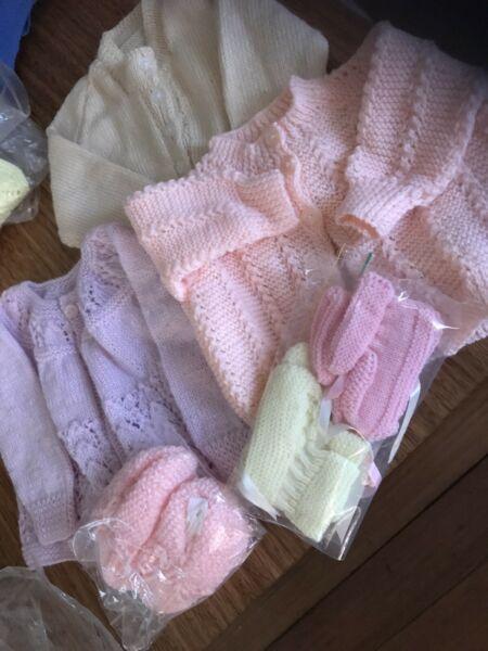 HAND KNITTED BABY JACKETS (8). NEW