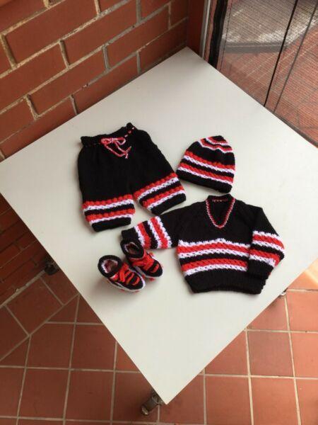 My hand knitted St Kilda set for a baby 0-3months