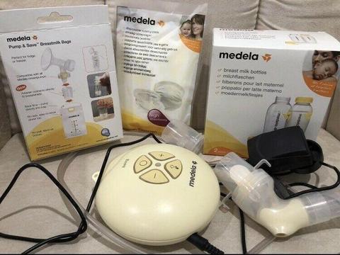 Medela swing pump and accessories