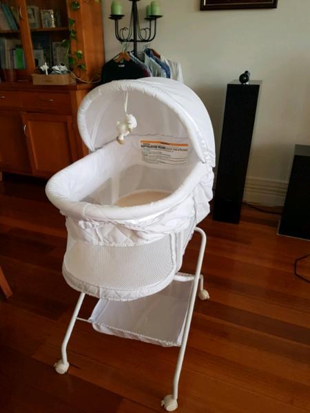 Bassinet with wheels and storage underneath