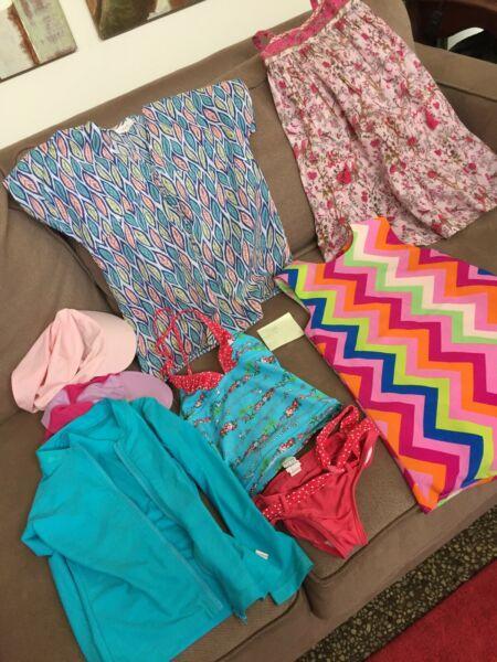 2 summer Dresses, 2 piece bathers with Rashi, 1 top , 2 hats. Size 6