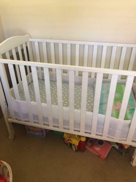 White cot and mattress with air mesh
