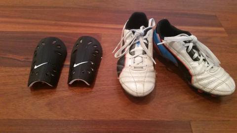 Boys soccer shoes and shin pads