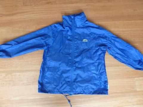 Slazenger: Kids Rain Jacket hood in zip pocket. 8yrs